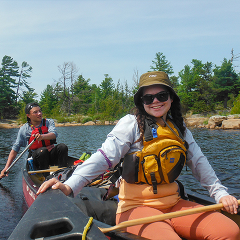 Image of two people in a canoe on a lake
