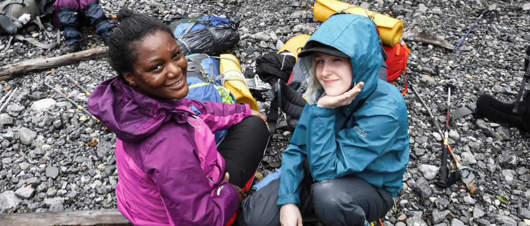 Image of two teens happily resting and smiling