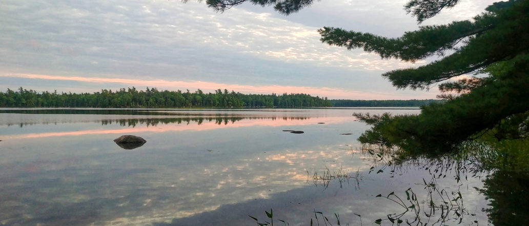 Image of a still lake at sunset