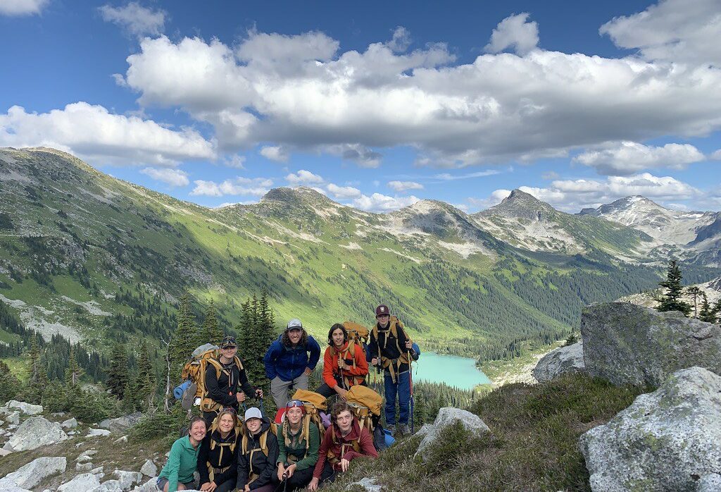 teens posing infront of mountain