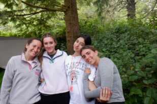 girls smiling in a forest
