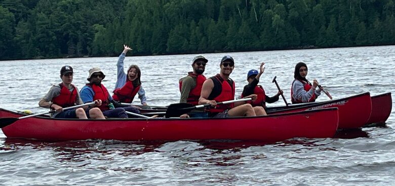 group of people canoeing on a lake