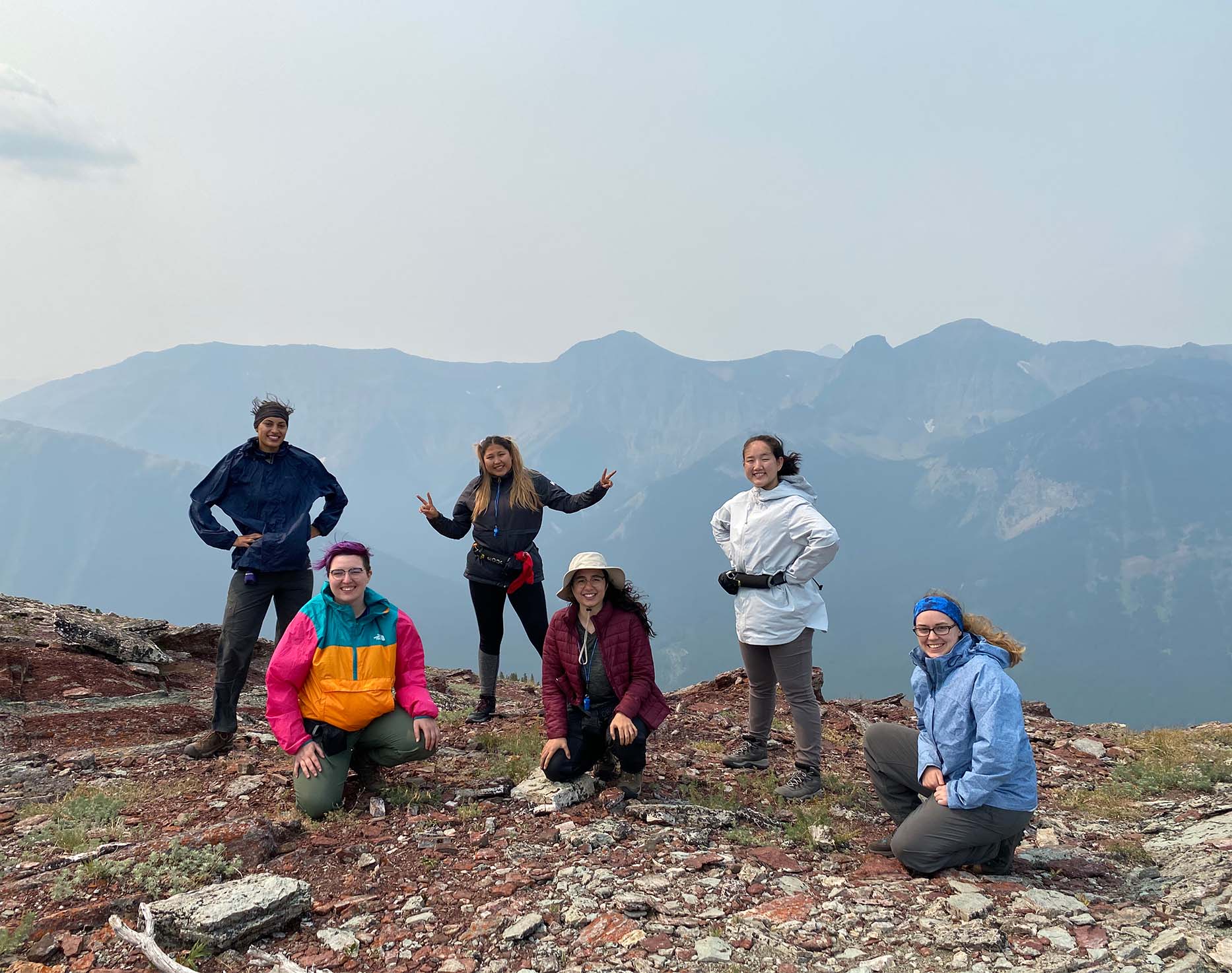 Image of a group of 6 participants on the top of a mountain