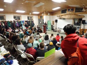 A group of people standing in the snow at our Make Peace with Winter conference