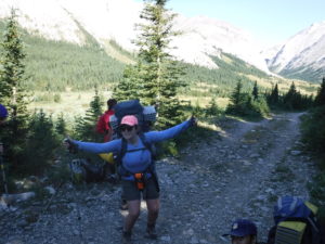 girl hiking rocky mountains