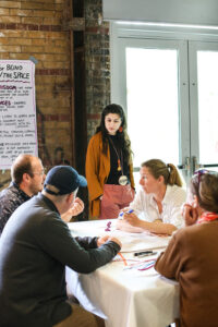 people talking surrounding a table