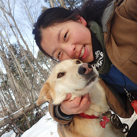 Maddie with one of the dog sledding huskies